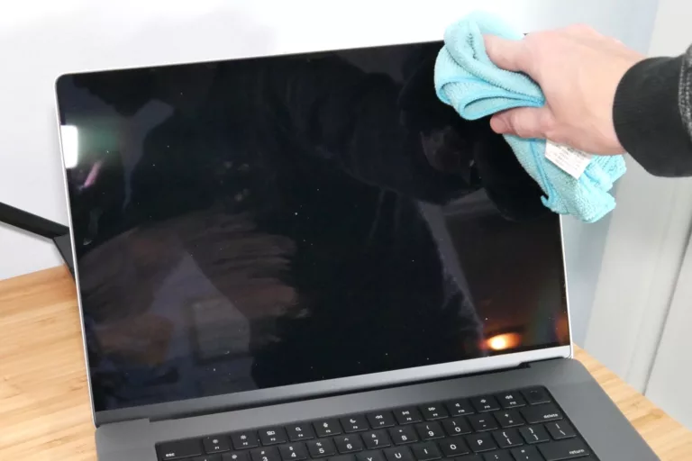 How do I clean the screen of my MacBook?